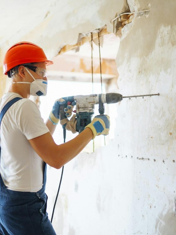 repairer-in-boilersuit-holding-tools-apartment-repair-and-renovation-concept-building-.jpg